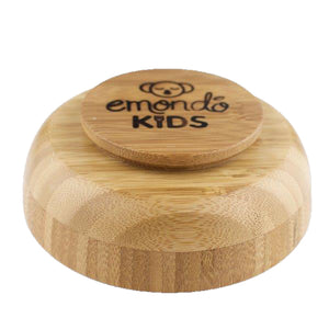 Bamboo bowl upside down with emondo kids logo on the bottom of it