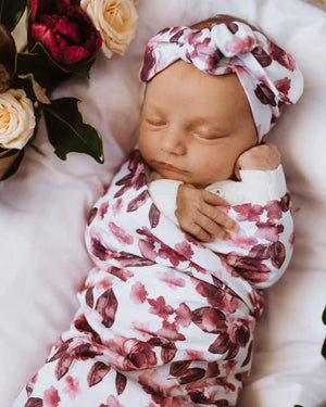 Fleur jersey swaddle and bow on baby