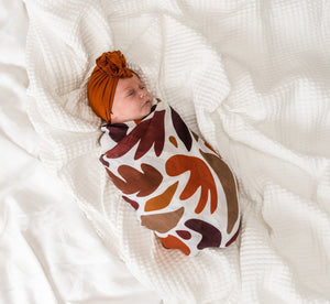 Montana Agate Swaddle wrapped around a baby