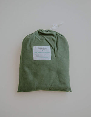 Olive green cot sheet in cot bag