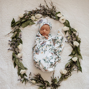 Eucalypt leaves baby jersey wrap and beanie on newborn