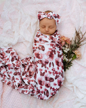 Fleur jersey swaddle and bow on baby