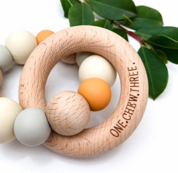 Mixed colours of the natural beech wood and silicone teethers