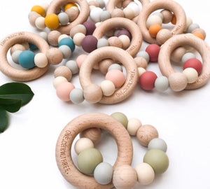 Mixed colours of the natural beech wood and silicone teethers