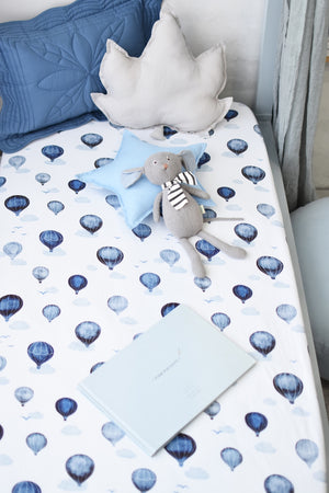White jersey fabric cot fitted cot sheet with blue hot air ballons and clouds